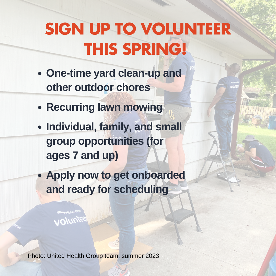 Group of volunteers painting a house